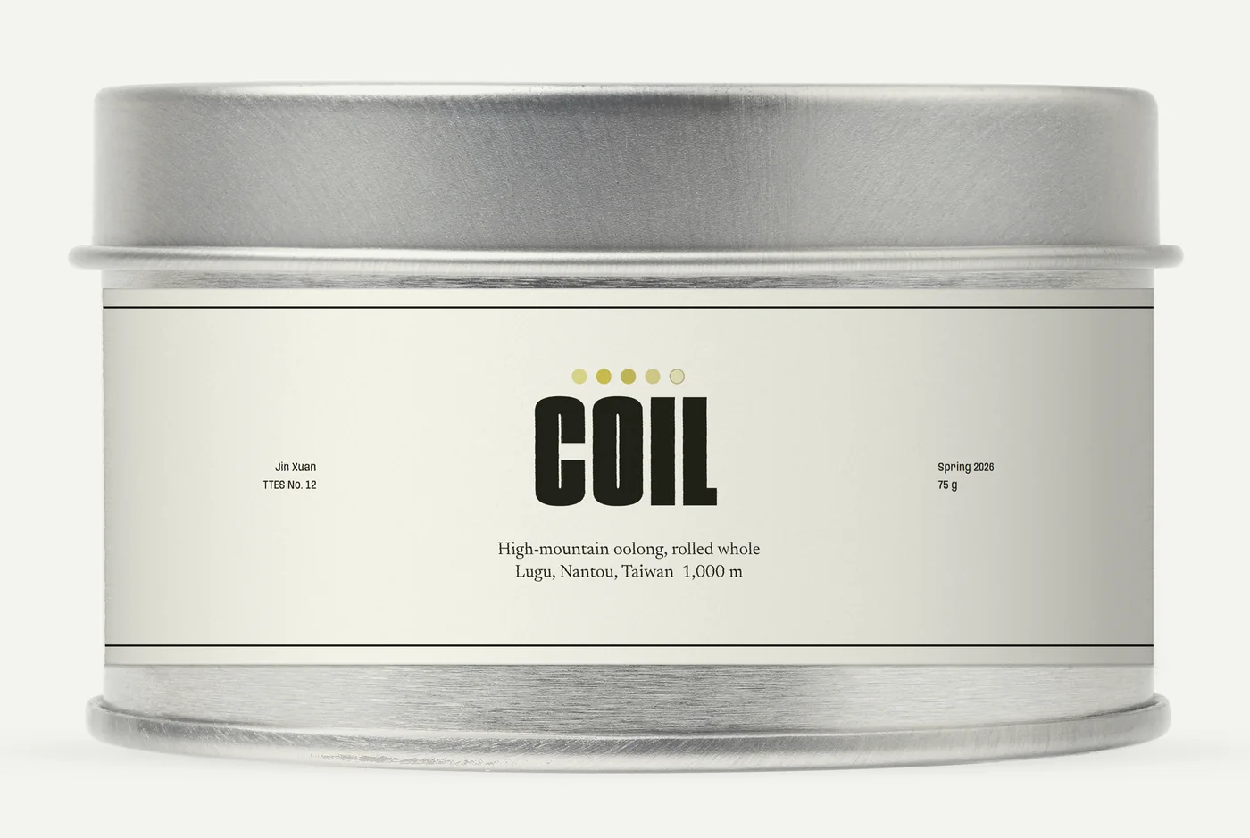 The COIL tin: brushed steel with a slip lid and a paper label printed with the word COIL, five small circles, Jin Xuan, Spring 2026 and 75 g.