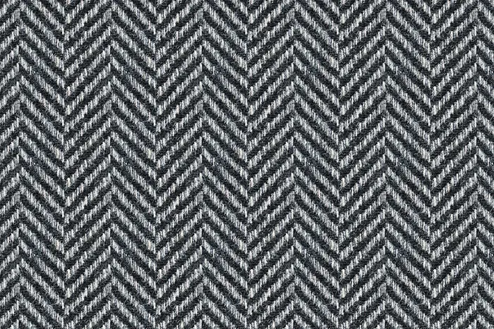 A close view of grey herringbone tweed.