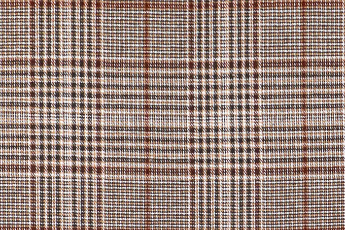 Brown and ecru glen check with a rust overcheck.