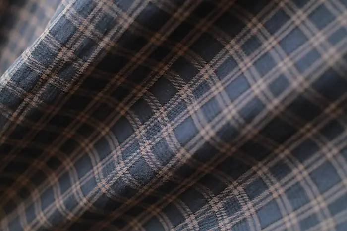 Blue, brown and ecru plaid flannel, draped.