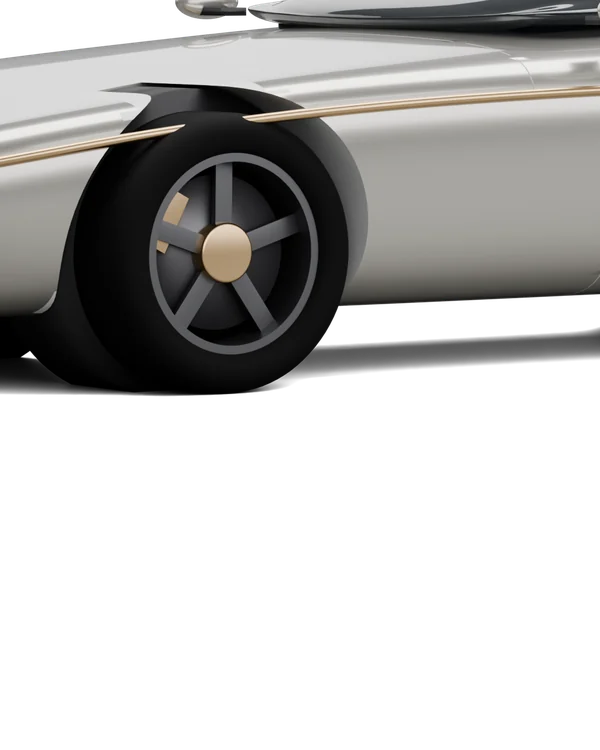 Close on the Carvel’s flank: the bronze half-round strake crossing the door shut line above the front wheel