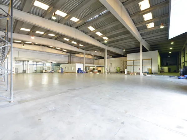 The new shed: a long, bright, empty hall with skylights