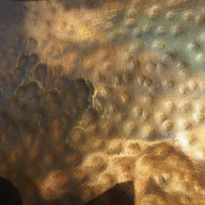 Hammered bronze, close